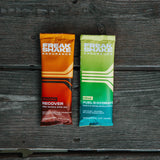 Freak Shake Endurance Starter Pack single use packets on a wood backdrop for long distance runners, marathons, trail runs, rowing, and heat training.