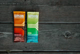 Freak Shake Endurance Starter Pack single use packets on a wood backdrop for long distance runners, marathons, trail runs, rowing, and heat training.