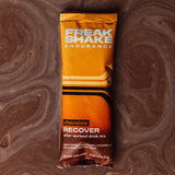 Freak Shake Chocolate Post Workout Recovery Shake in single serve packaging floating in chocolate shake
